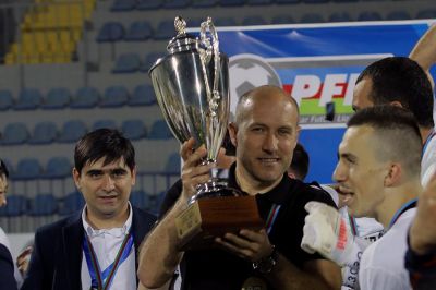 Çempion baş məşqçi və kapitan